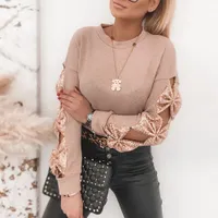 Elegant women's sweater with bows along sleeves