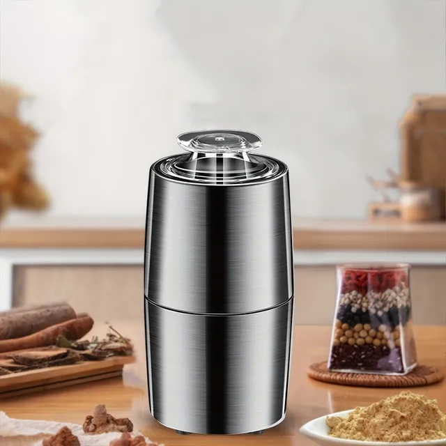 Silent electric coffee and spices grinder - stainless steel knives on freshly ground coffee, spices, nuts and grain