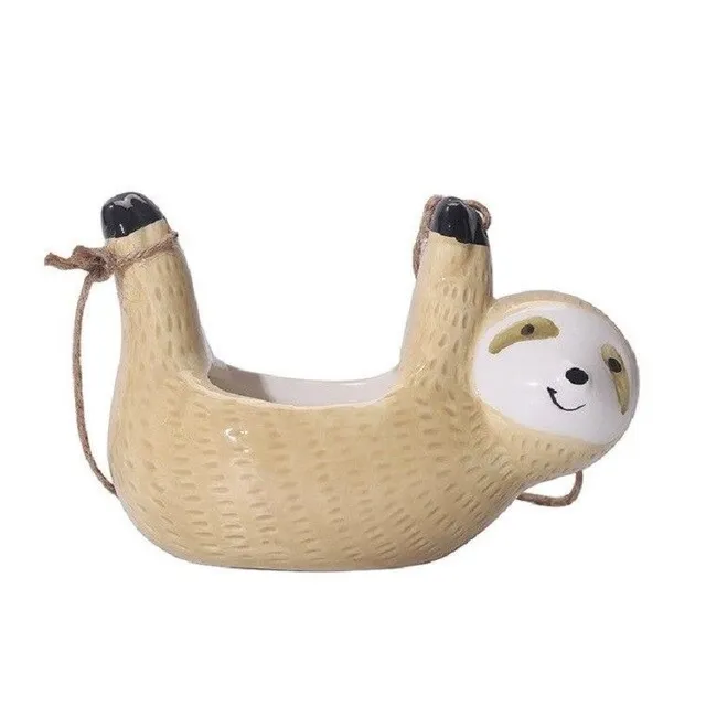 Decorative flower pot in the shape of a sloth