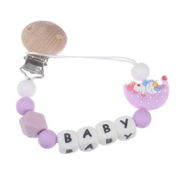 Silicone pacifier clip with motif of moon and bite