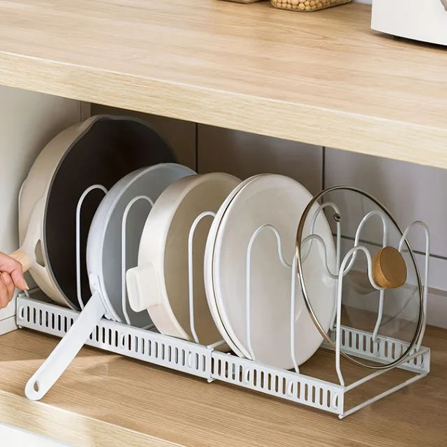 Sofa bed organizer on pots and pans in wardrobe