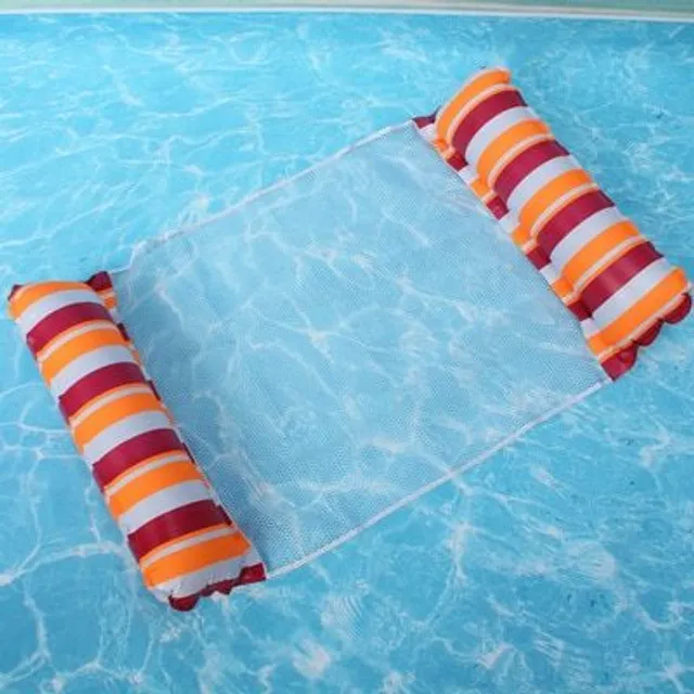 Foldable inflatable lounger for water