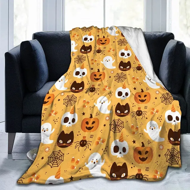 Autumn flannel blanket with a motif of pumpkins and leaves for sofa, bed or couch