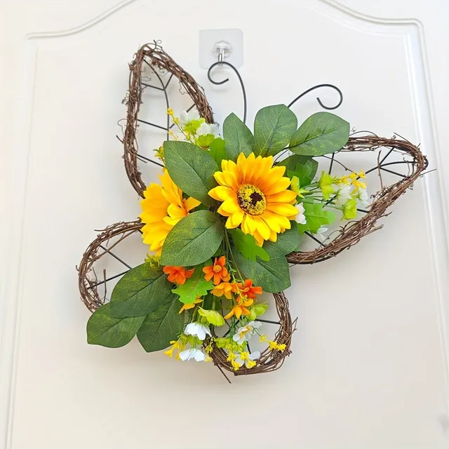 Spring wreath with butterflies and sunflowers on the door