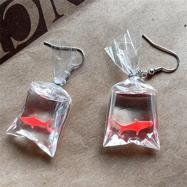 Funny earrings with a fish motif in Carrol bag