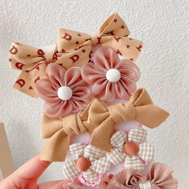 10 pcs of girl hair clips with motif flowers and bows for everyday life