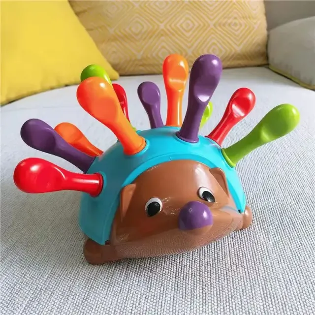 Children's educational toy in the shape of a hedgehog for the development of fine motor skills