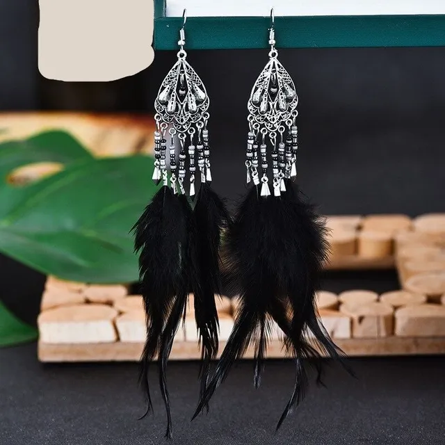 Women's dangle earrings with feathers