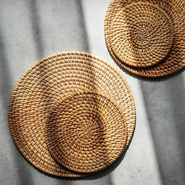 Modern knitted trendy favorite rattan coaster on the table under the cup