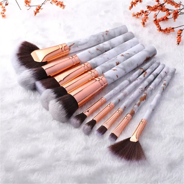 Set of make-up brushes in marble design