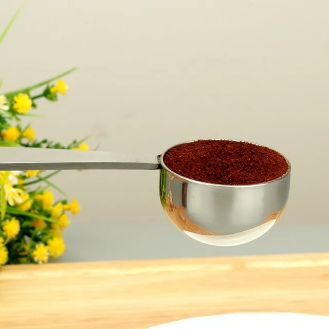 Stainless steel coffee scoop with squeezer