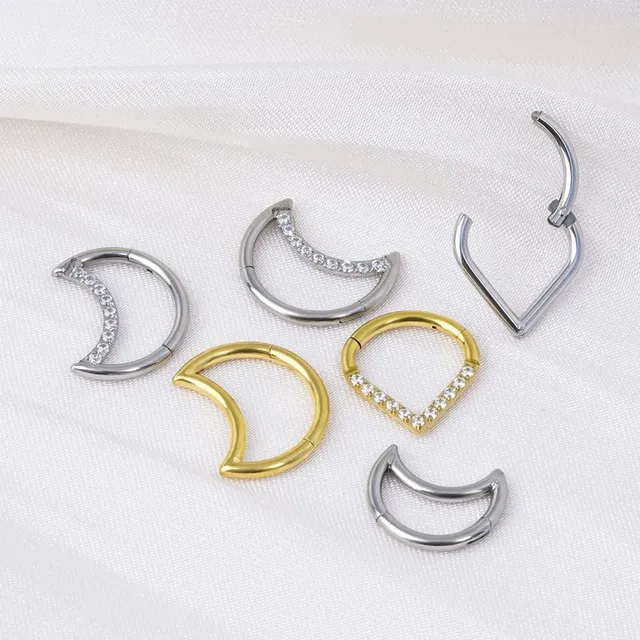 Trendy septum nose piercing in the shape of a teardrop or crescent