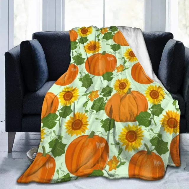 Autumn flannel blanket with a motif of pumpkins and leaves for sofa, bed or couch