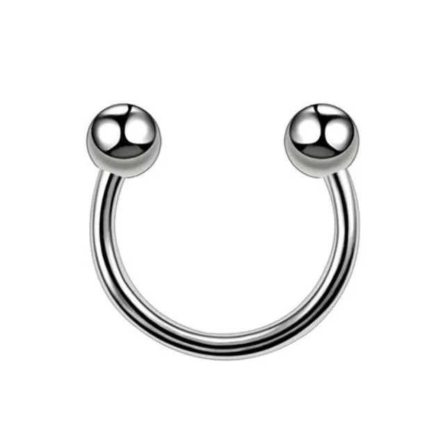 Trendy septum nose piercing with a spike or ball