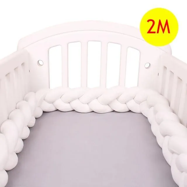 Crib mattress cover in the shape of a braid