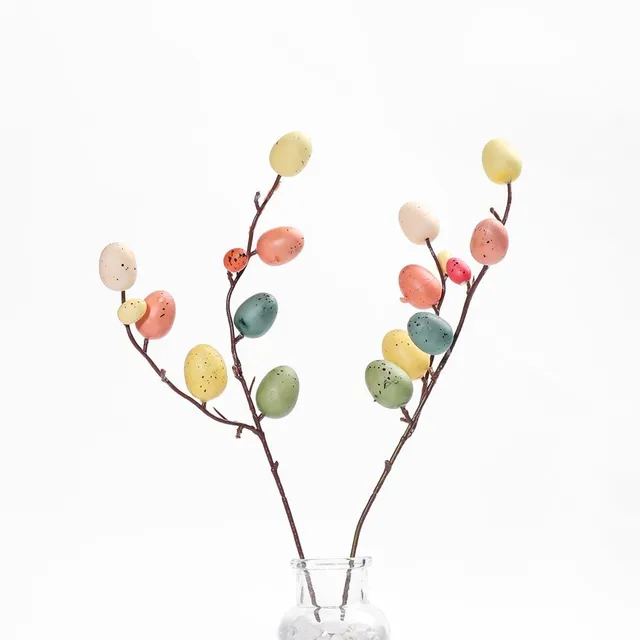 Easter decorative branch with artificial coloured eggs