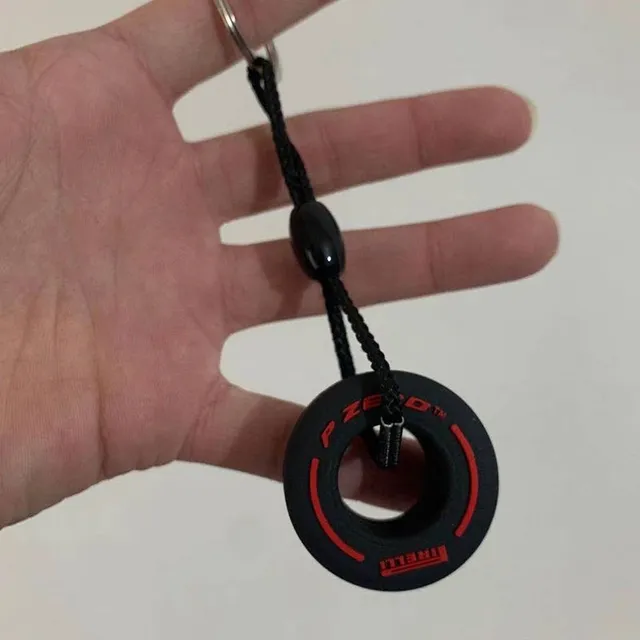 Pendant in the shape of a tyre