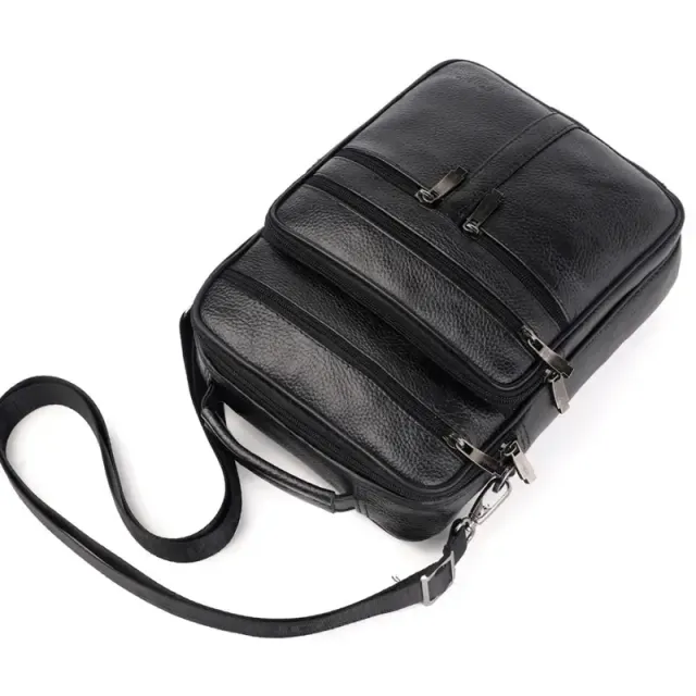 Male spacious bag made of right leather from the face layer - hand, messenger, with multiple zippers, shoulder and hand, ideal for business