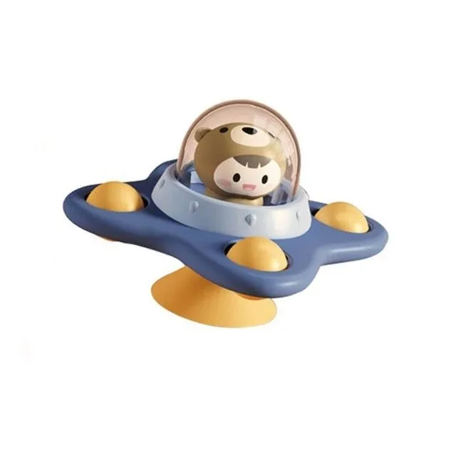 Rotating toy with suction cup