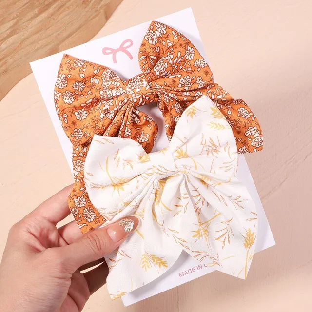 Cute modern baby hair clip with perfect bow motif - more variants