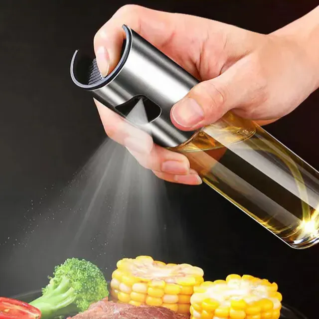 Olive oil sprayer and vinegar in a glass bottle