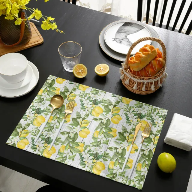 Set of cloths on the dining table with lemon motif