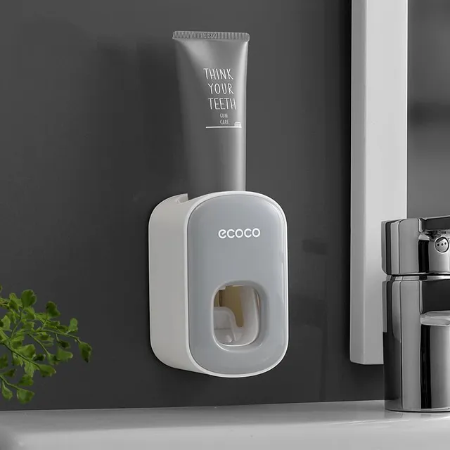 Toothpaste dispenser with toothbrush holder and paste