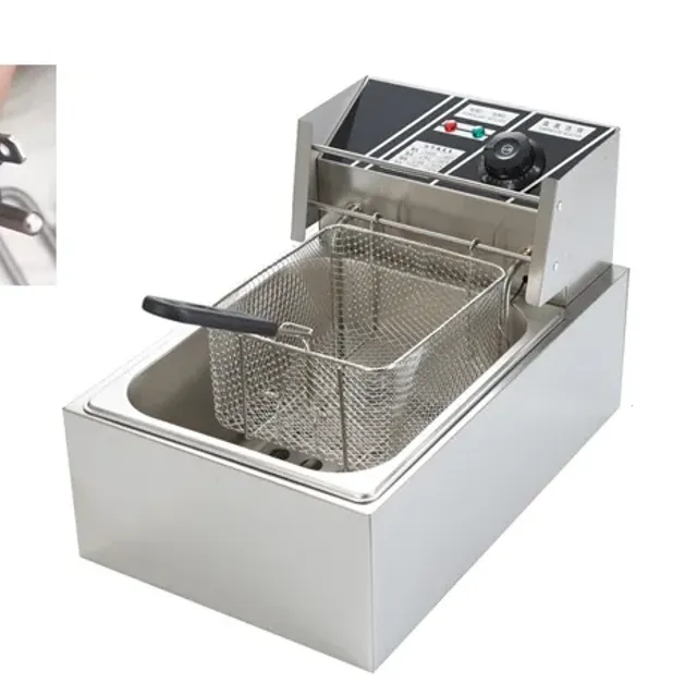 Electric fryer with basket and lid, kitchen fryer on work plate