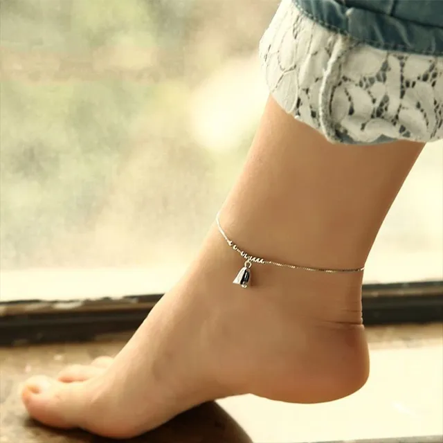 Women's stylish ankle bracelet in silver color with bell-shaped pendant