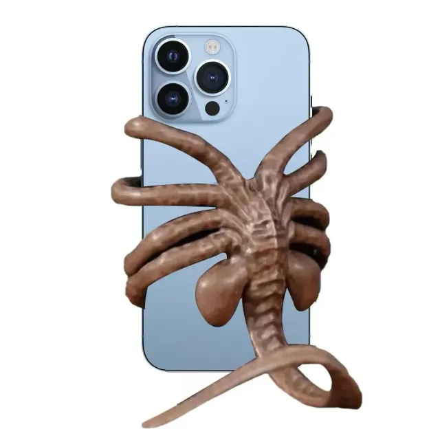 Facehugger phone holder in the shape of an alien with creative design