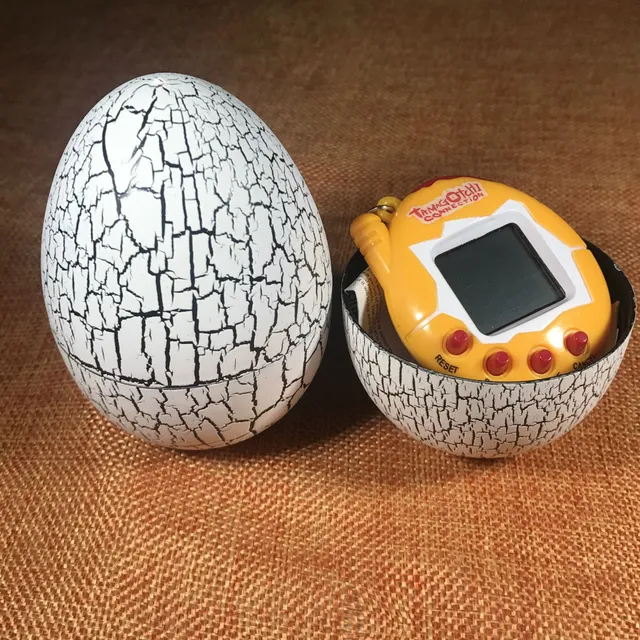 Children's retro toy Tamagotchi in dinosaur egg