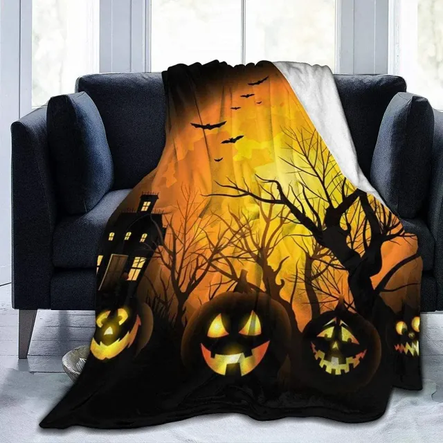 Autumn flannel blanket with a motif of pumpkins and leaves for sofa, bed or couch