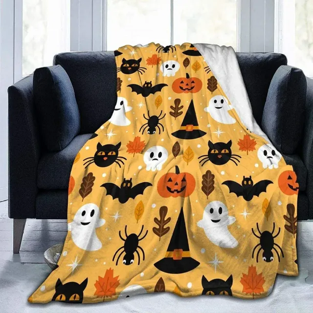 Autumn flannel blanket with a motif of pumpkins and leaves for sofa, bed or couch