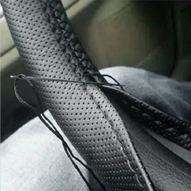 Quality steering wheel cover including needle and thread