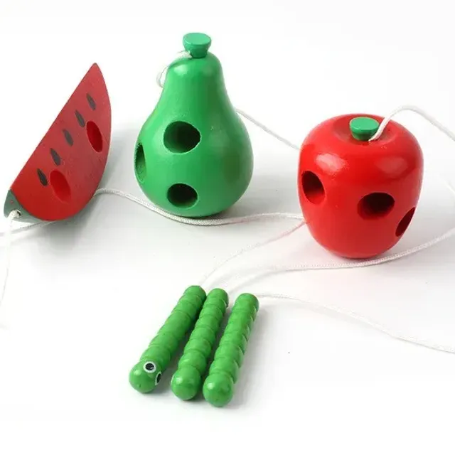 Fun wooden toy shaped fruit with worm on worm for sensory training