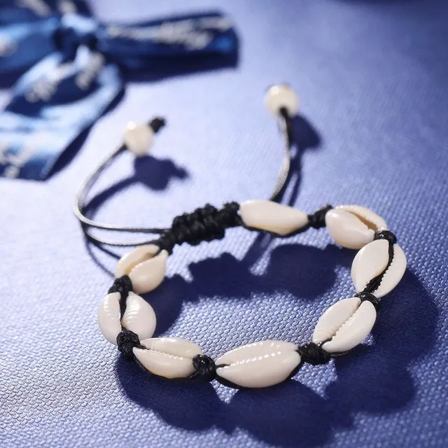 Bracelet made of shells on the leg