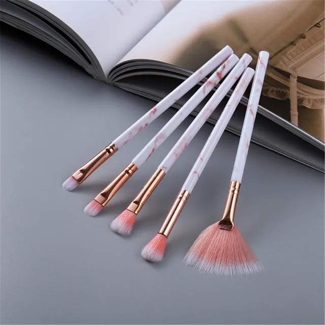 Set of make-up brushes in marble design