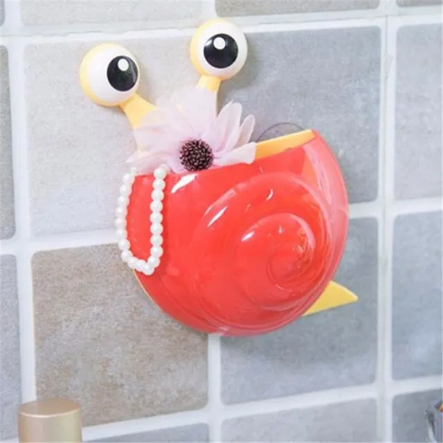 Cheerful toothbrush holder in the shape of a snail