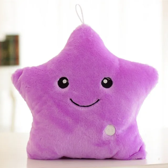 Beautiful plush glowing cushion in the shape of a star