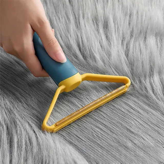 Useful scraper for combing hair from fabric - several color variants