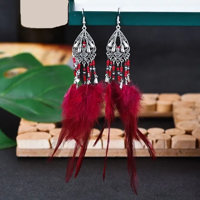 Women's dangle earrings with feathers