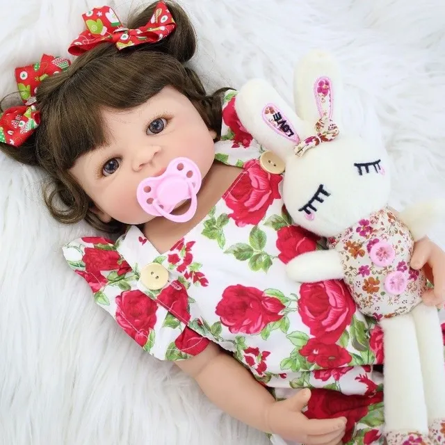 Realistic doll with accessories 55 cm