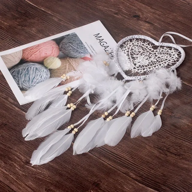 Beautiful heart-shaped dream catcher with feathers and beads