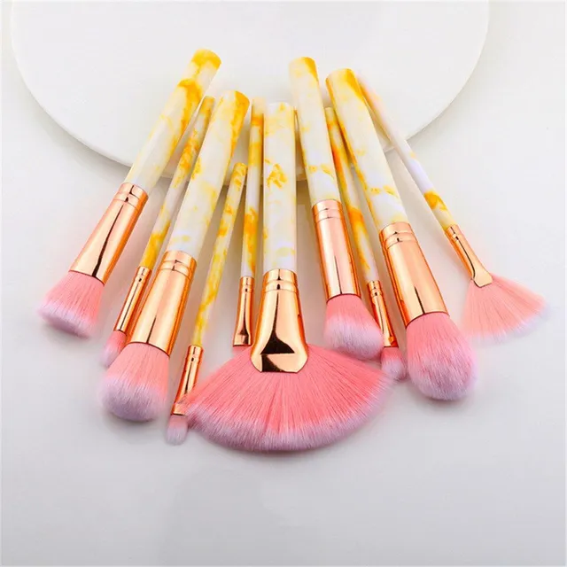 Set of make-up brushes in marble design