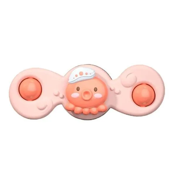 Rotating toy with suction cup for small children