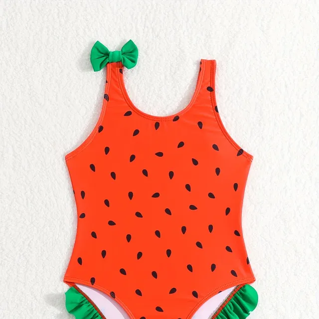 One-piece swimsuits for girls with a motif of watermelon and bows on hangers