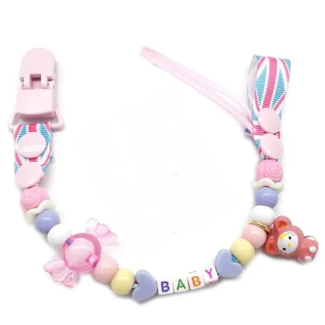 Toy with pacifier necklace © Babysitters