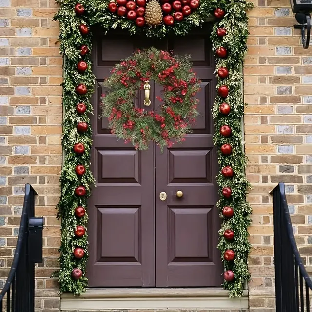 Christmas wreath with red berries and artificial eucalyptus