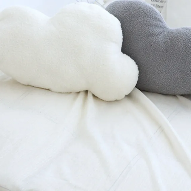 Baby pillow in the shape of a cloud