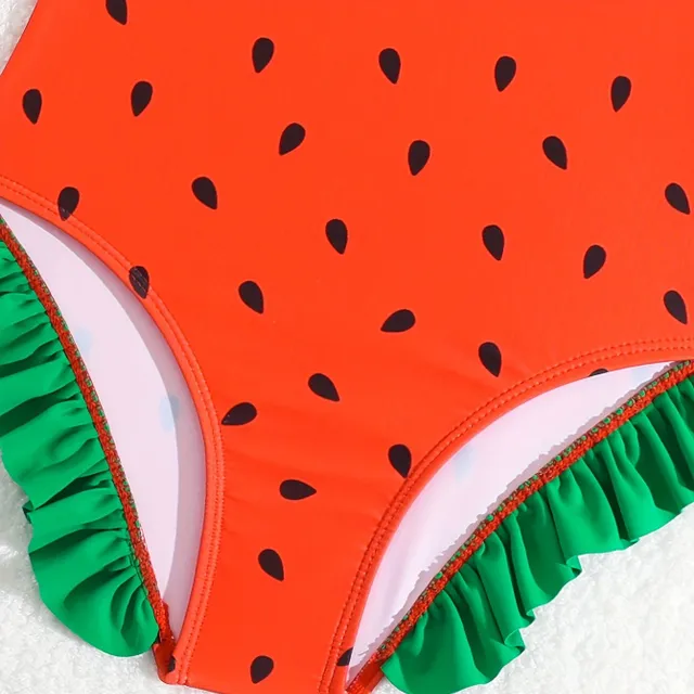 One-piece swimsuits for girls with a motif of watermelon and bows on hangers